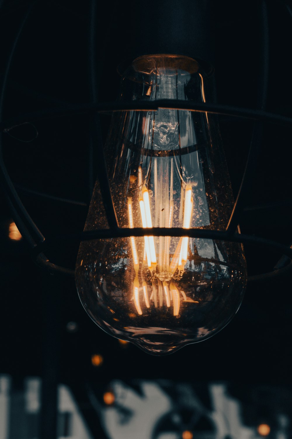 a light bulb hanging from the ceiling in a dark room