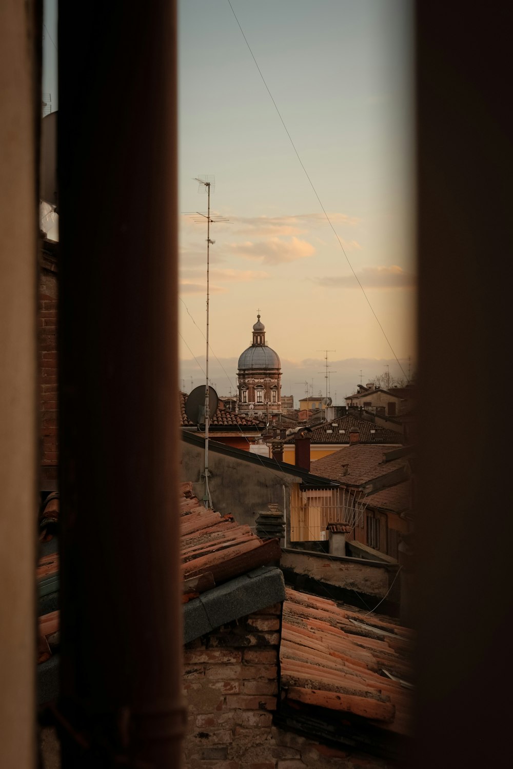 a view of a building with a dome in the background