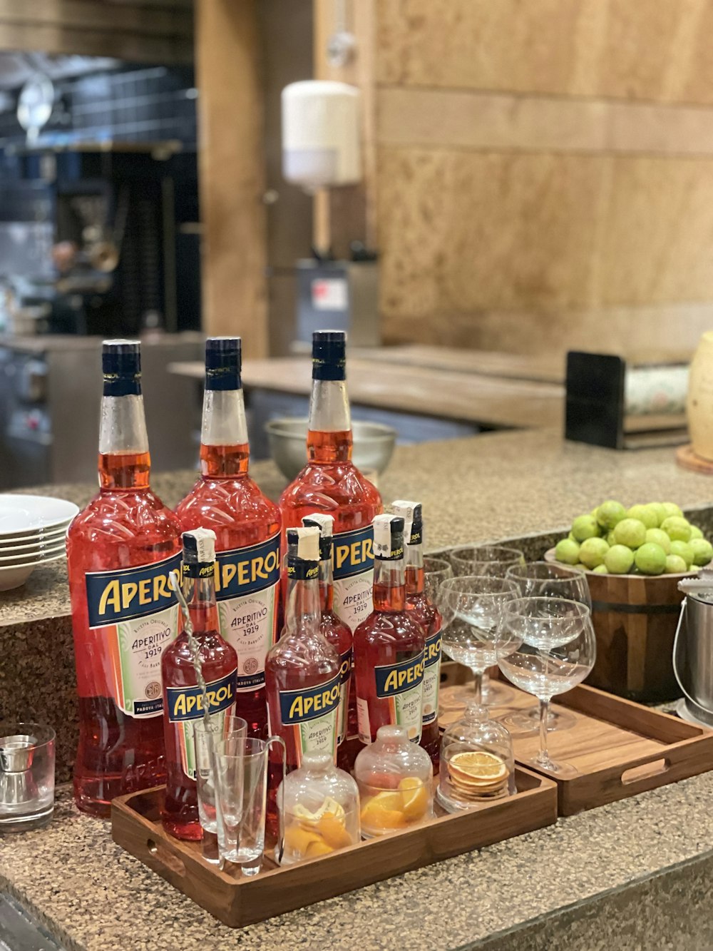 a tray with bottles of liquor and glasses on a counter