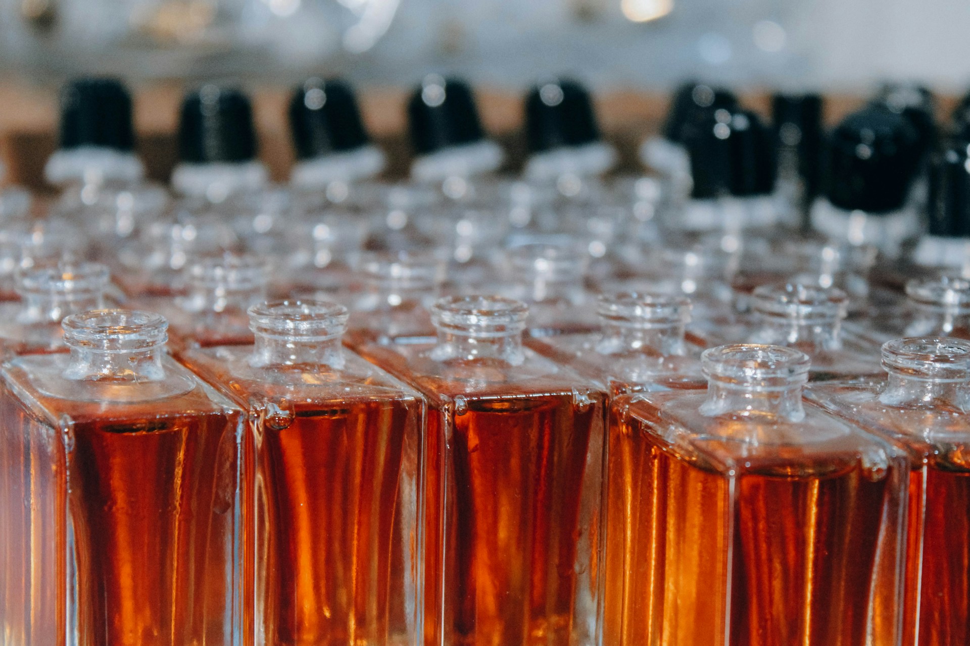 a table topped with lots of bottles filled with liquid