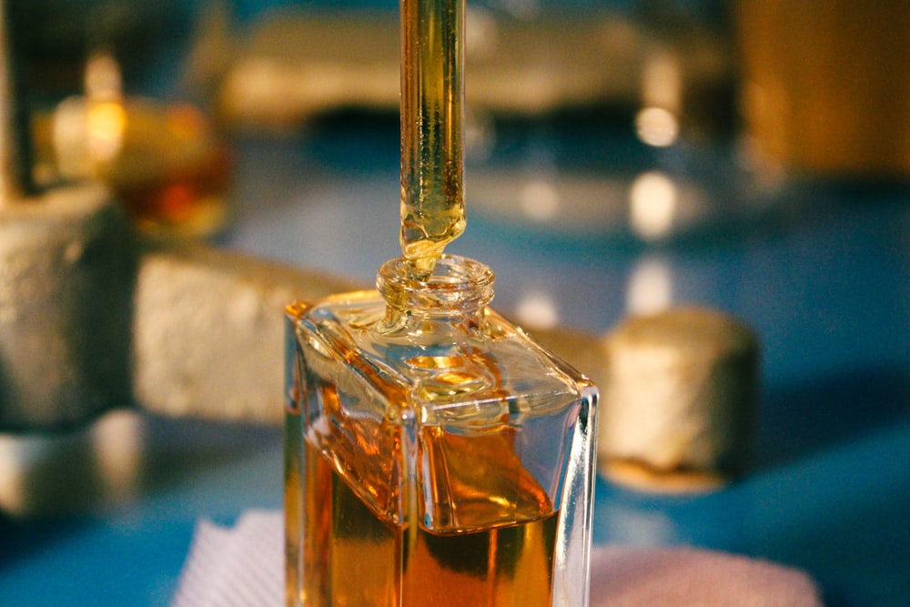 a bottle of liquid sitting on top of a table