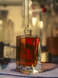 a bottle of liquid sitting on top of a table