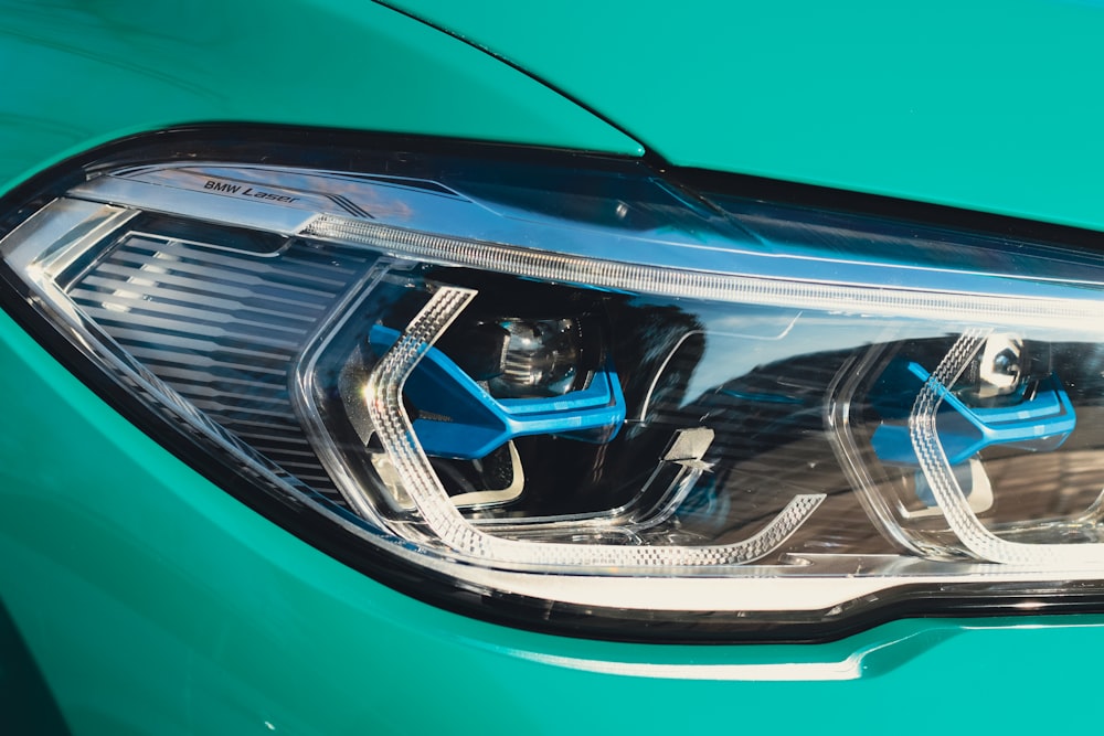 a close up of a blue car headlight