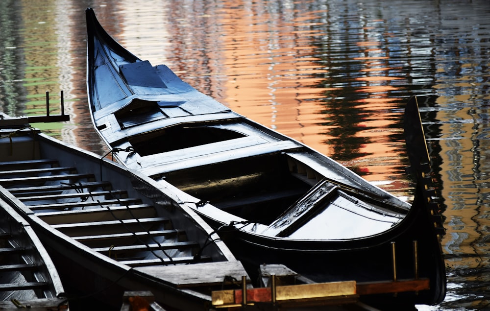 a couple of boats that are sitting in the water