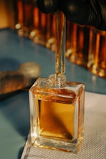 a bottle of perfume sitting on top of a table