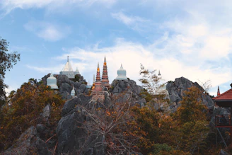 a view of a mountain with a temple on top of it