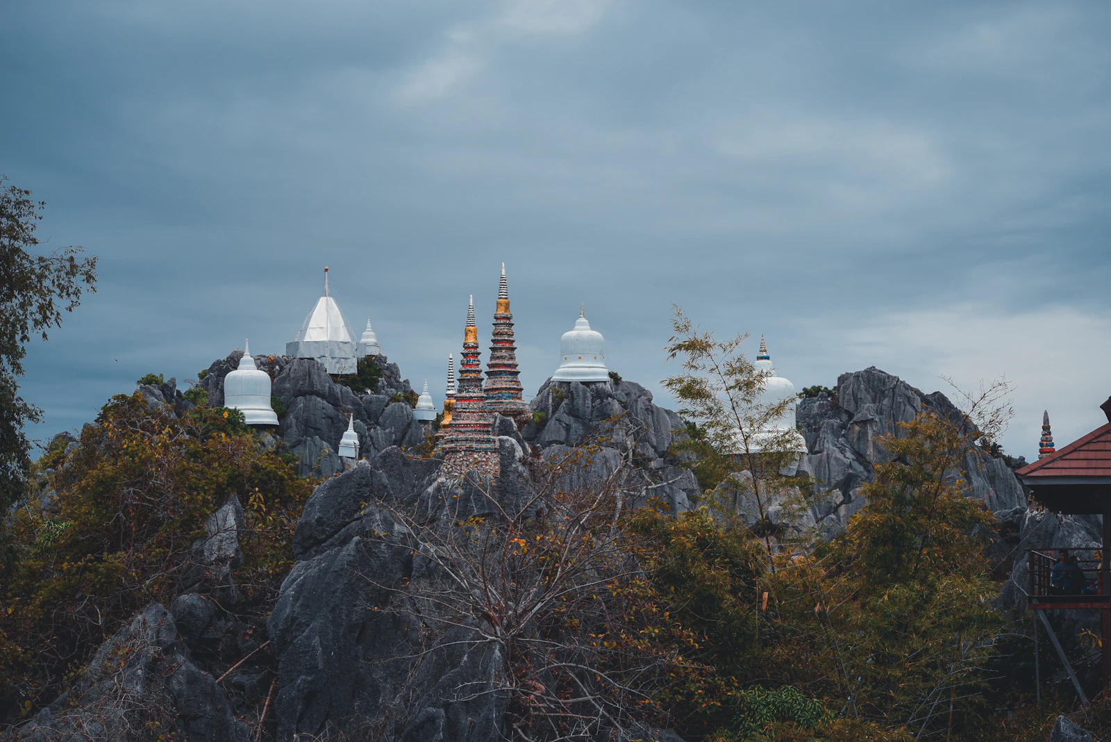 White pagodas on a rocky summit in Lampang province