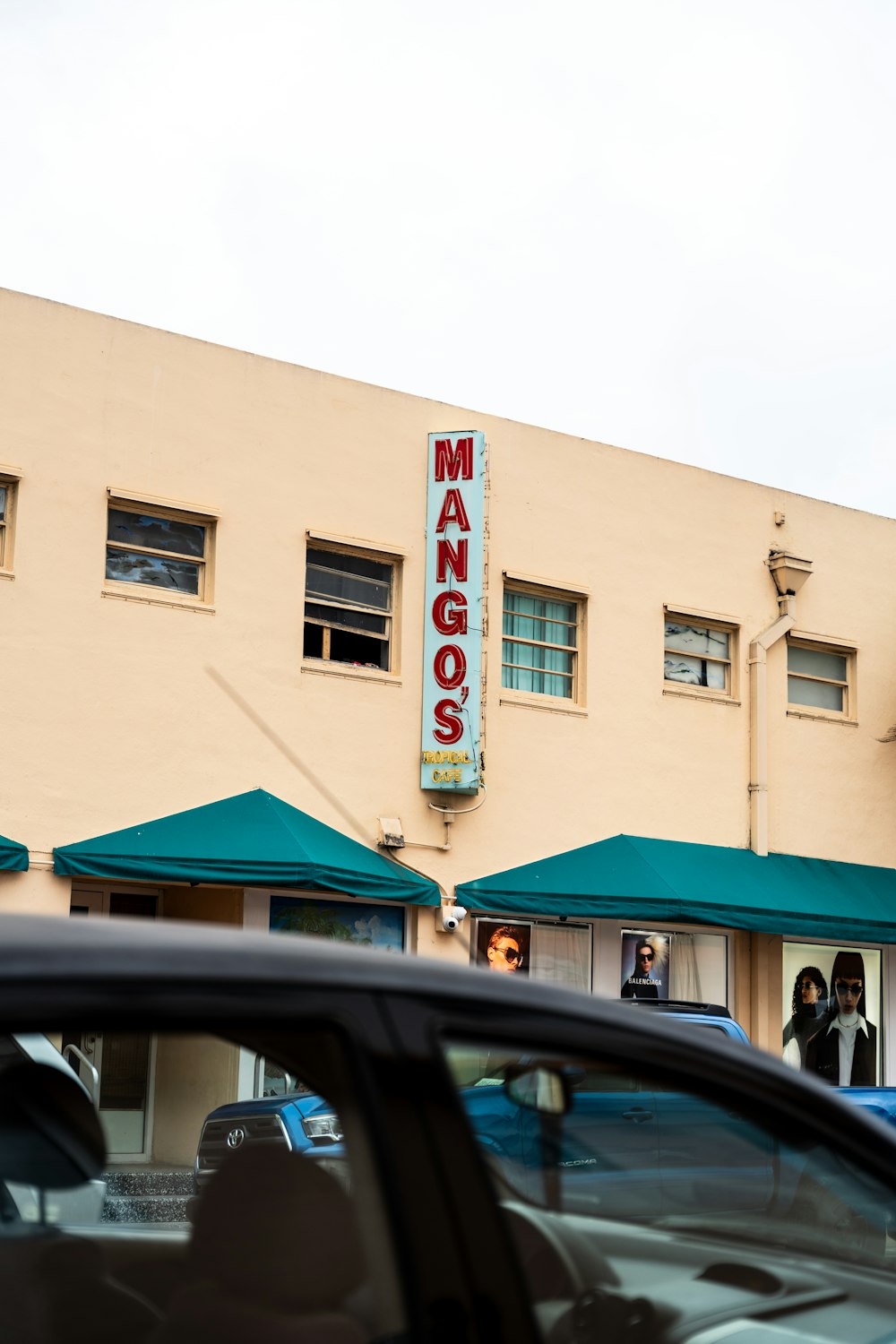 a car is parked in front of a building