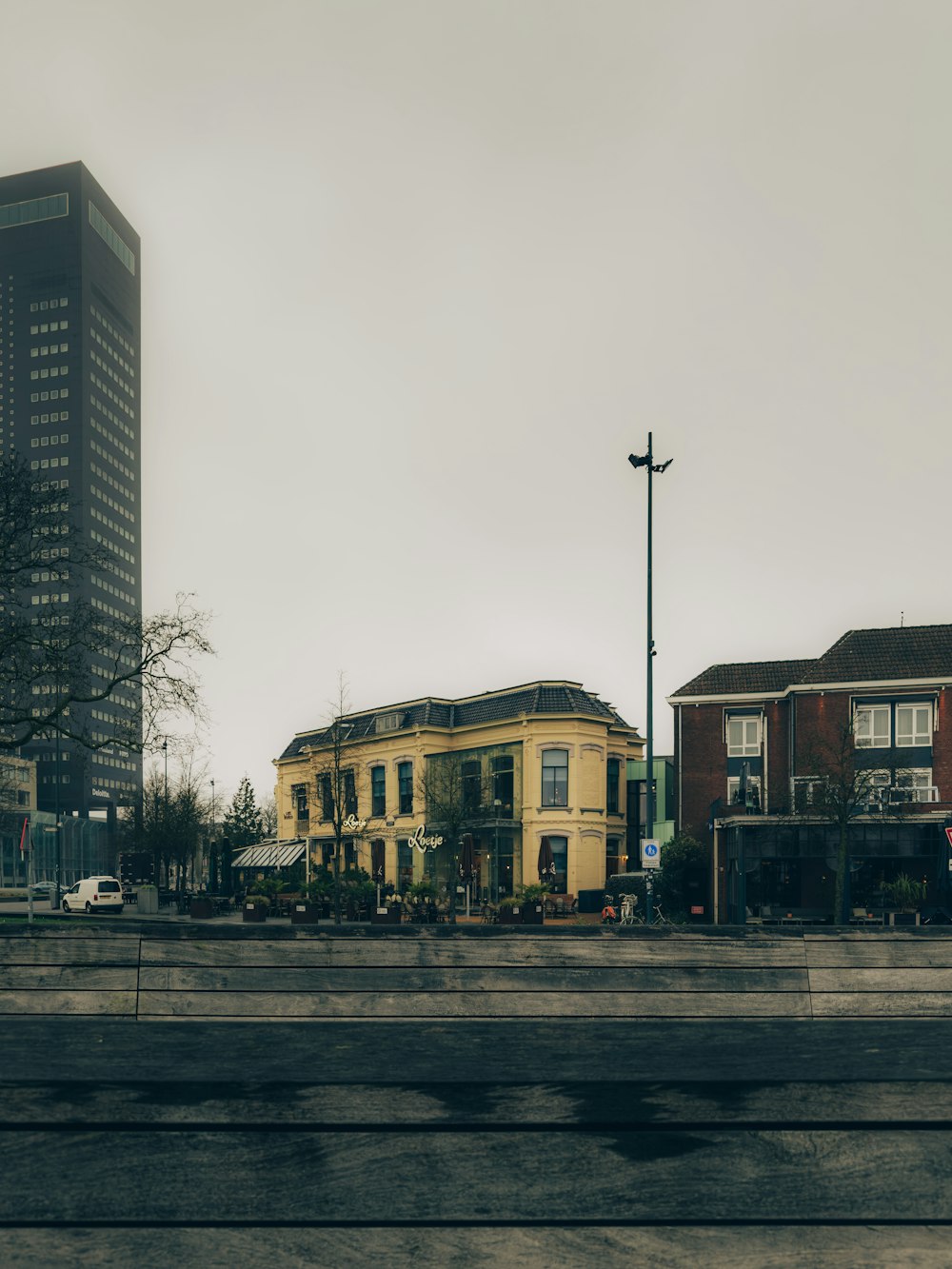 a yellow building in the middle of a city