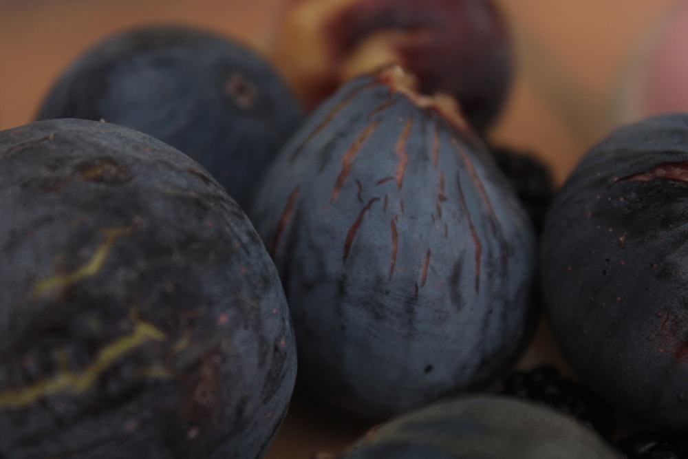 a bunch of plums that are sitting on a table