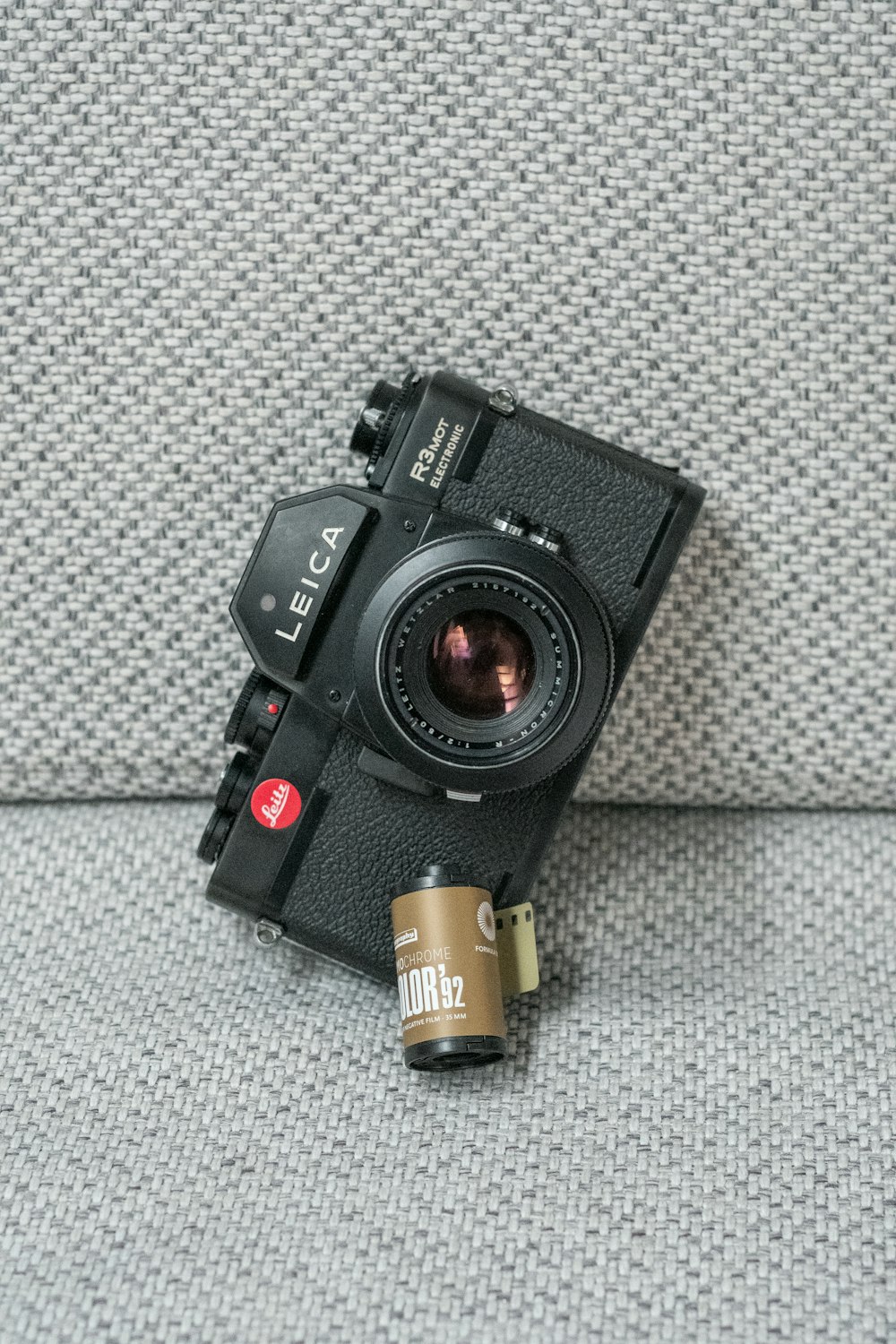 a camera sitting on top of a couch