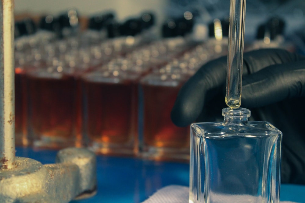 a bottle of liquid being filled with liquid