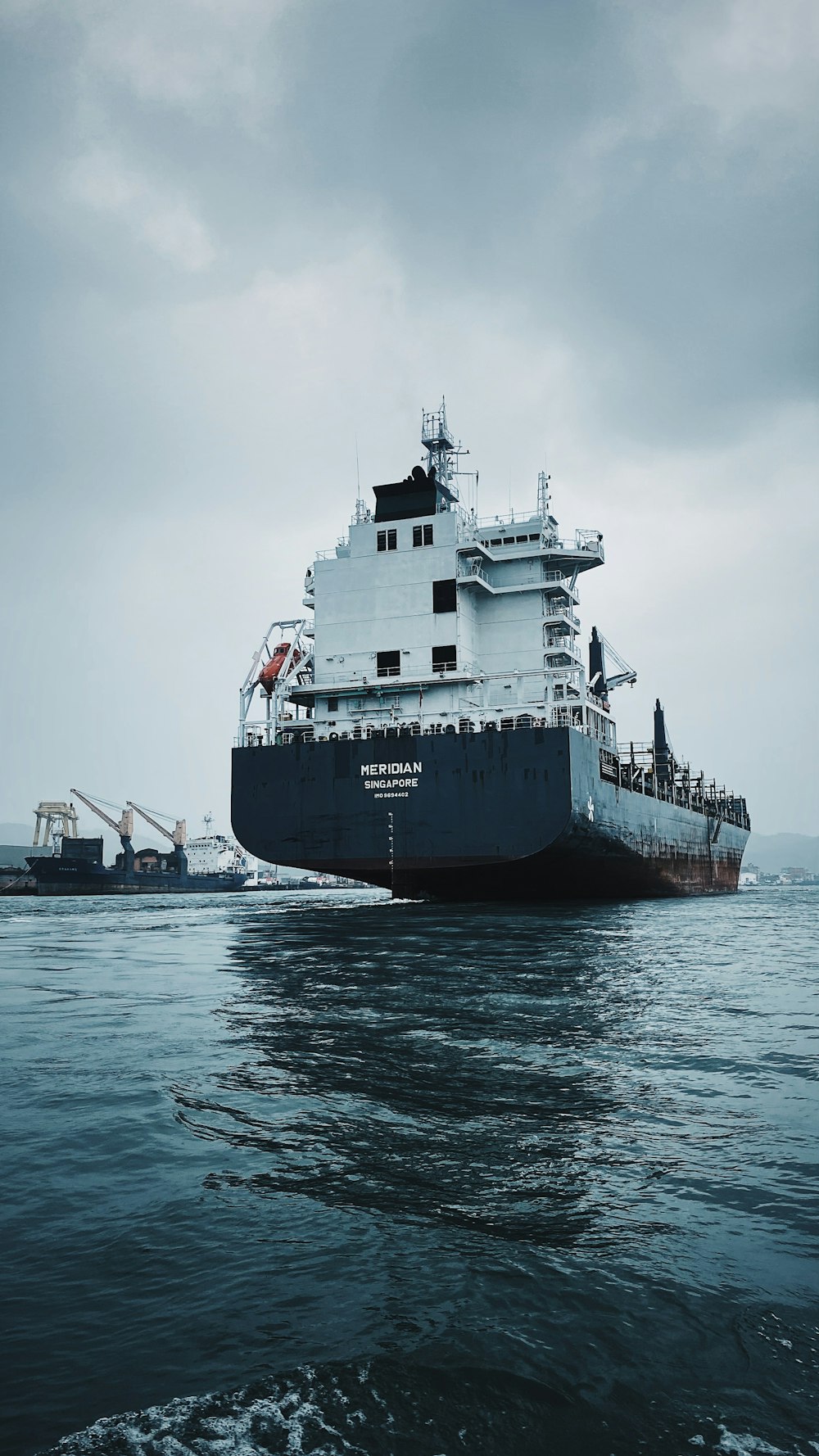 a large boat floating on top of a body of water