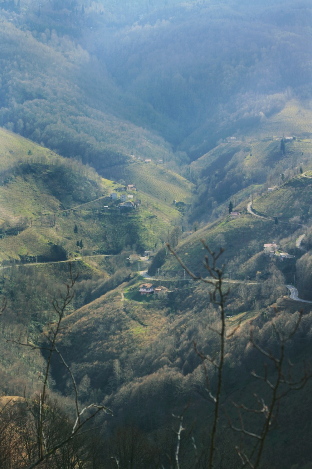a view of a valley with a road going through it
