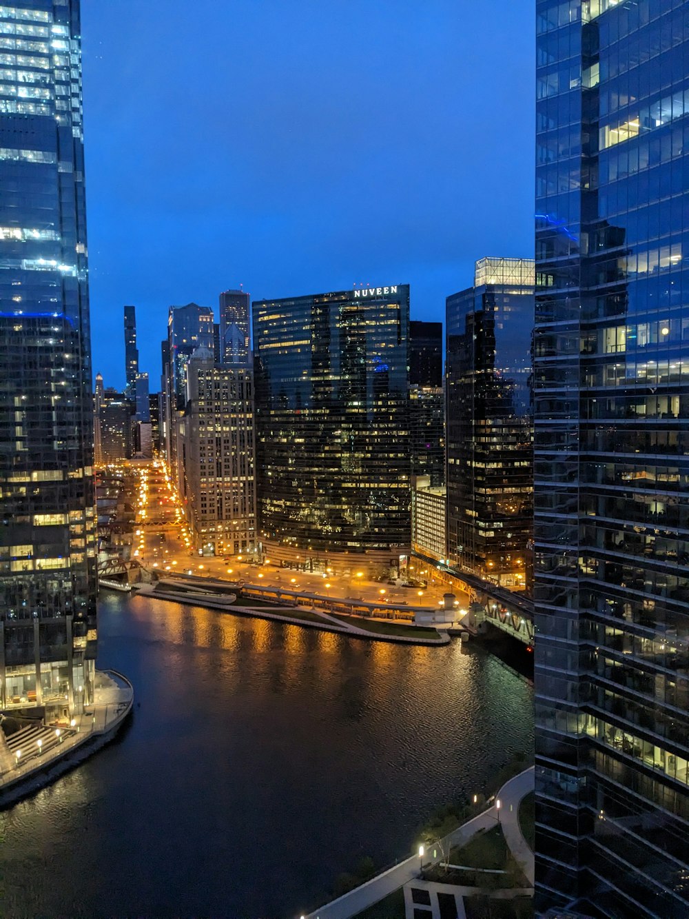 a river running through a city next to tall buildings