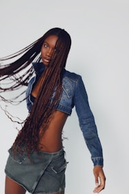 a woman with long hair and a jean jacket