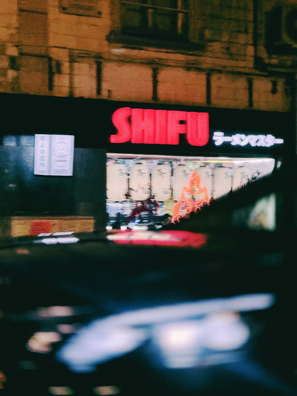 a blurry photo of a store front at night