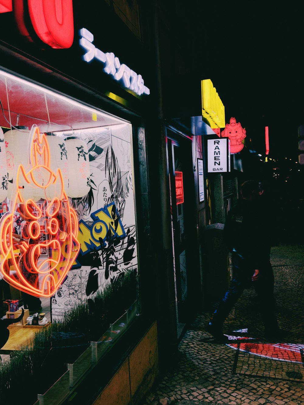 a neon sign in the window of a store