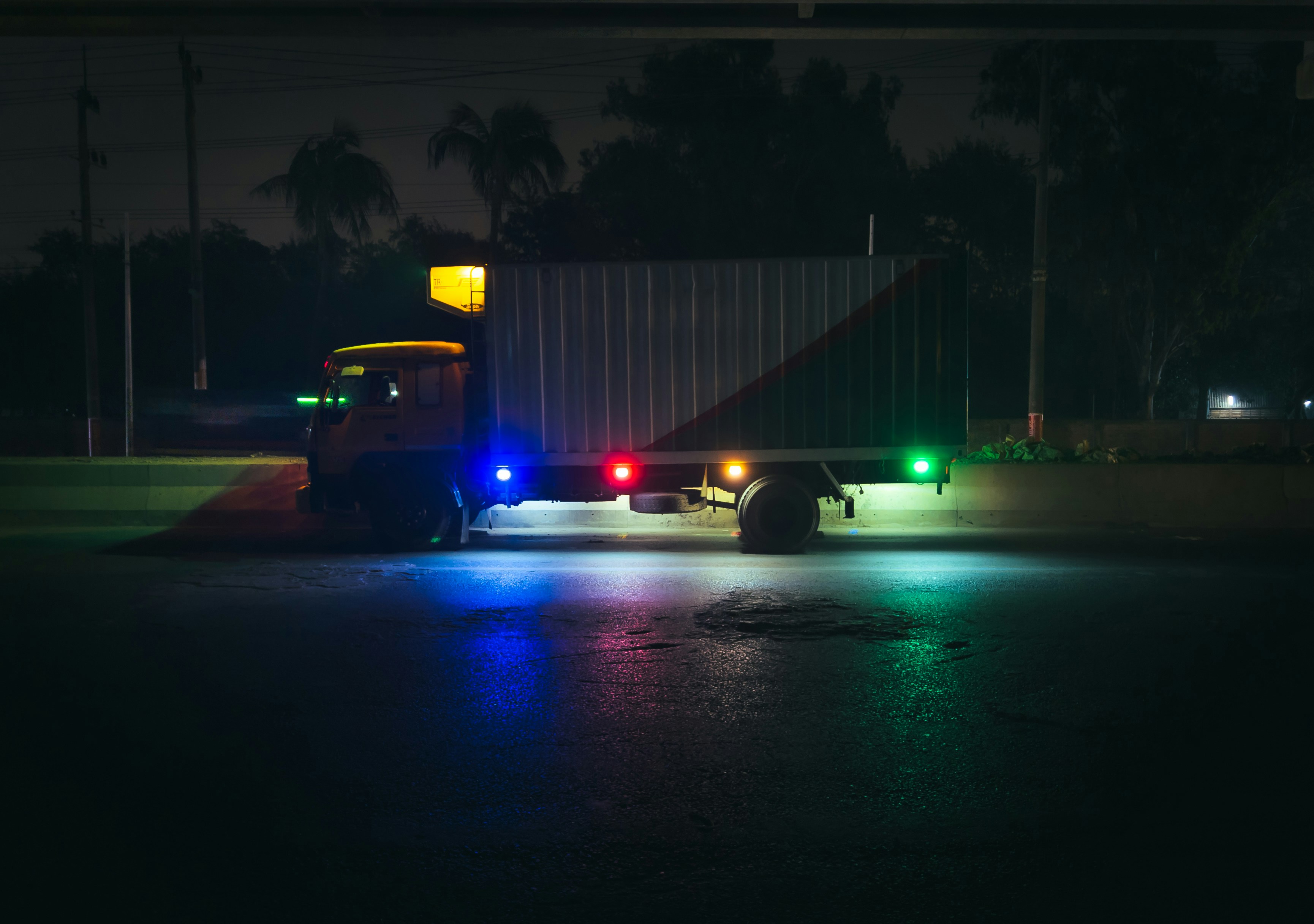 a police truck parked in a parking lot at night