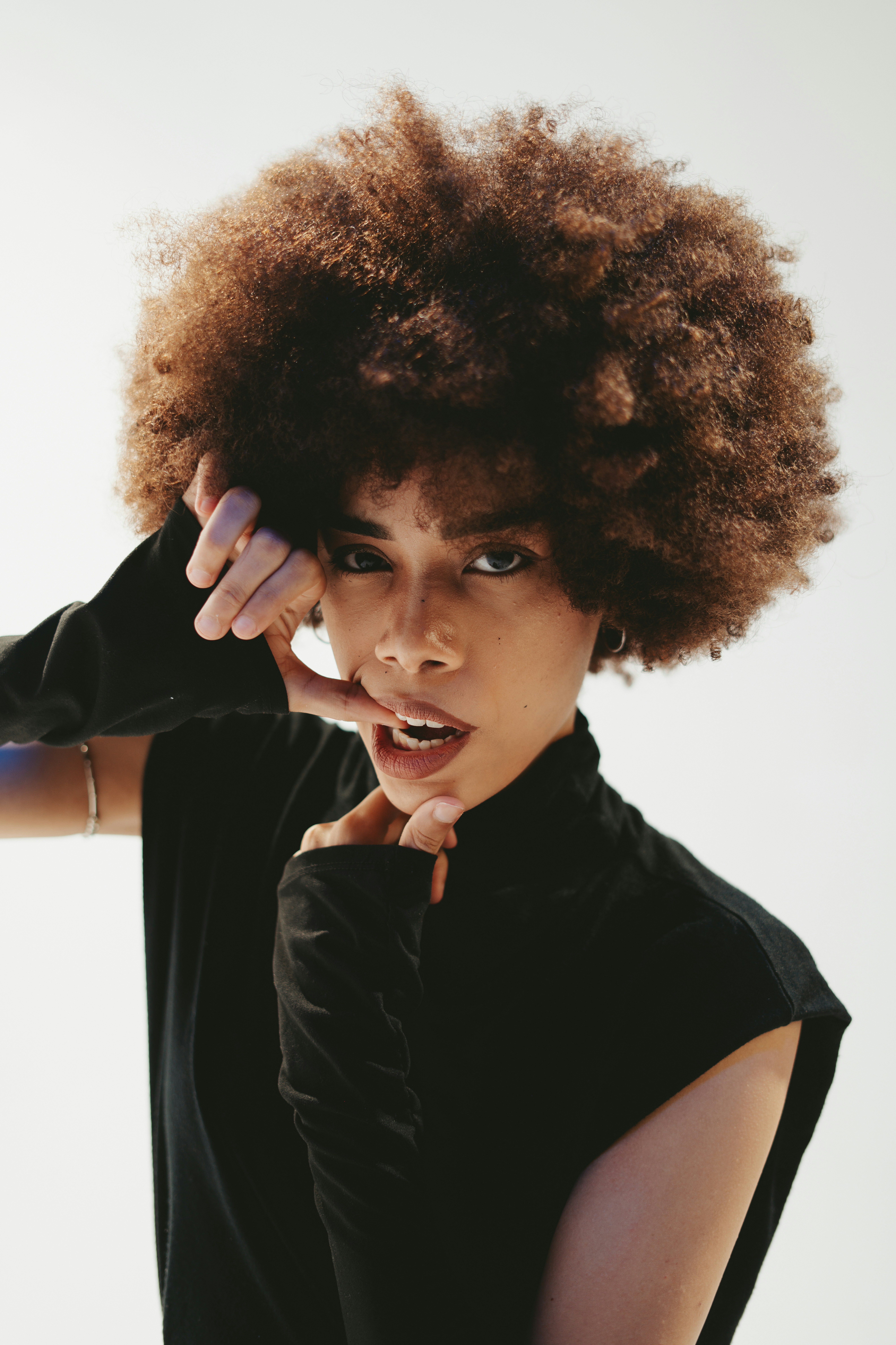 a close up of a person with an afro