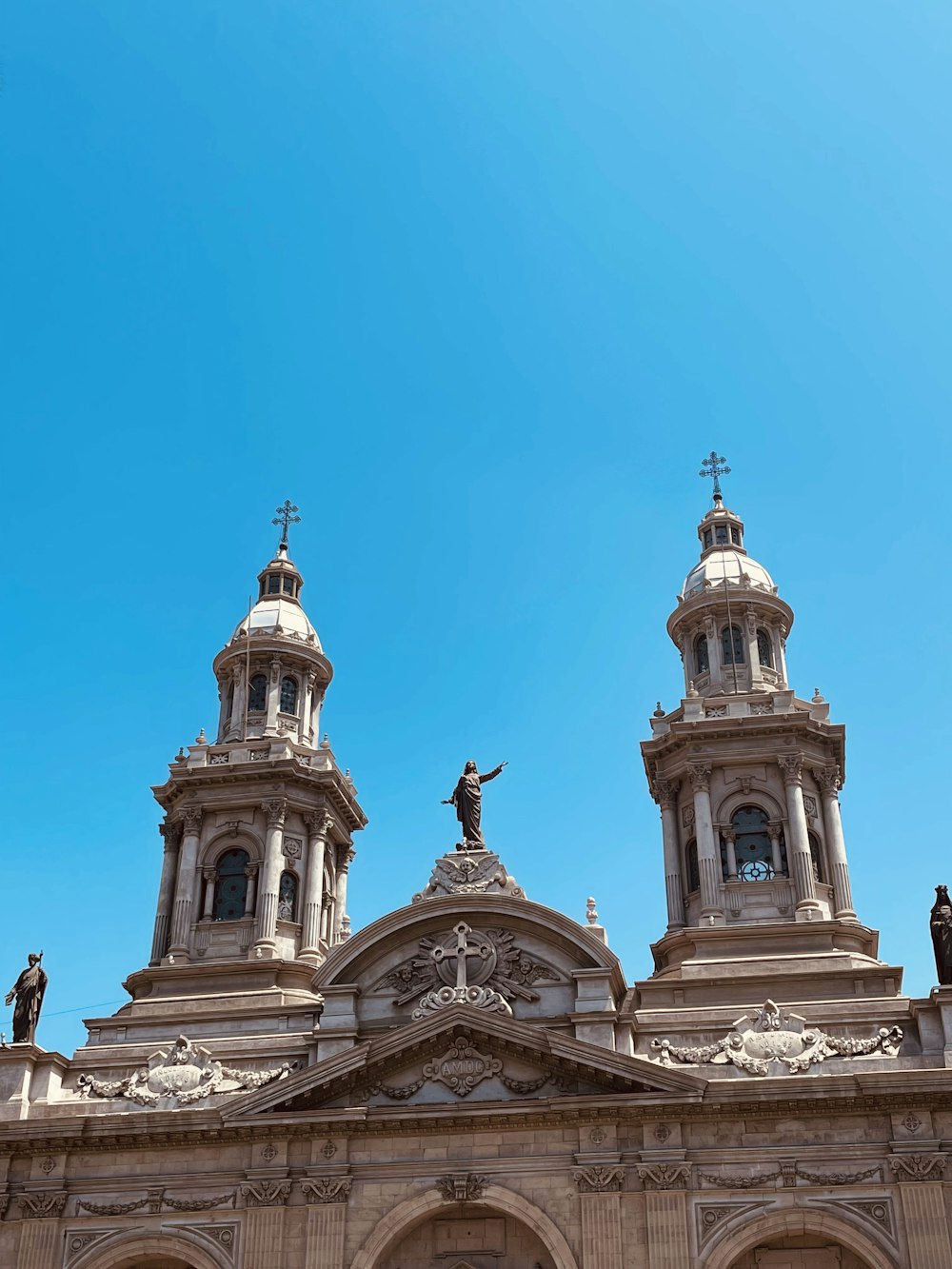 a large building with statues on top of it