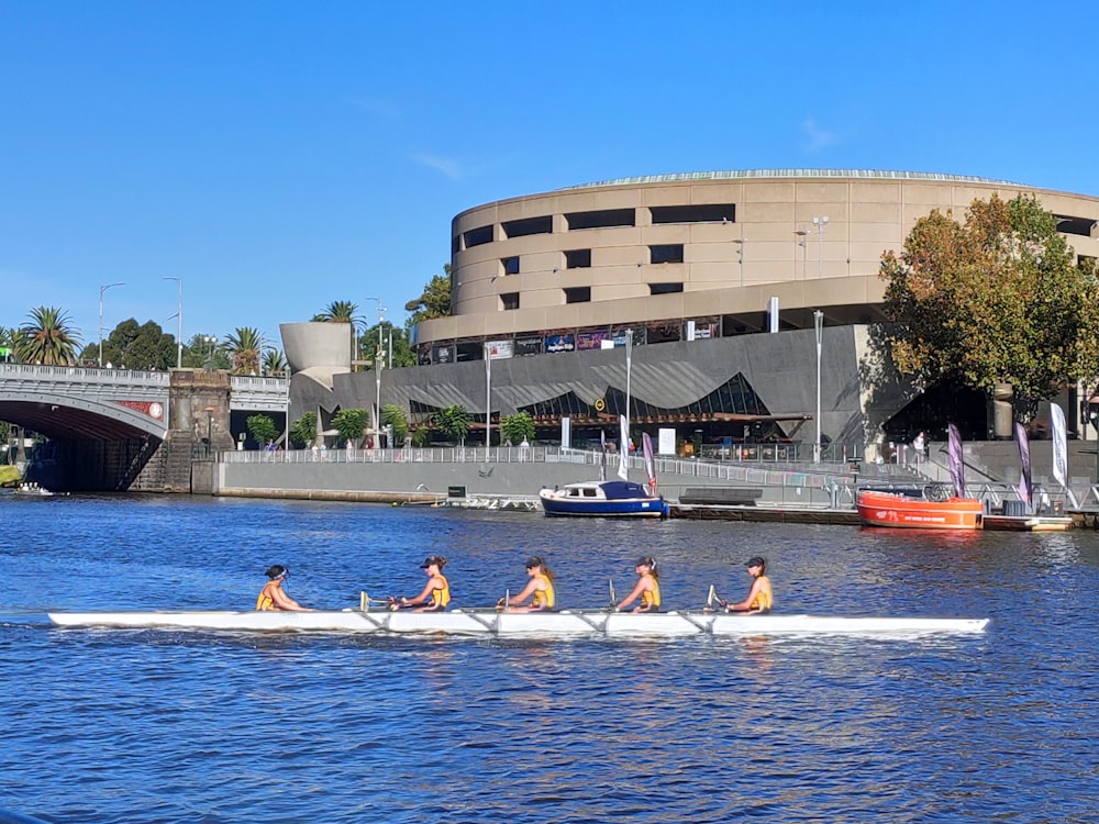 a group of people riding on the back of a boat