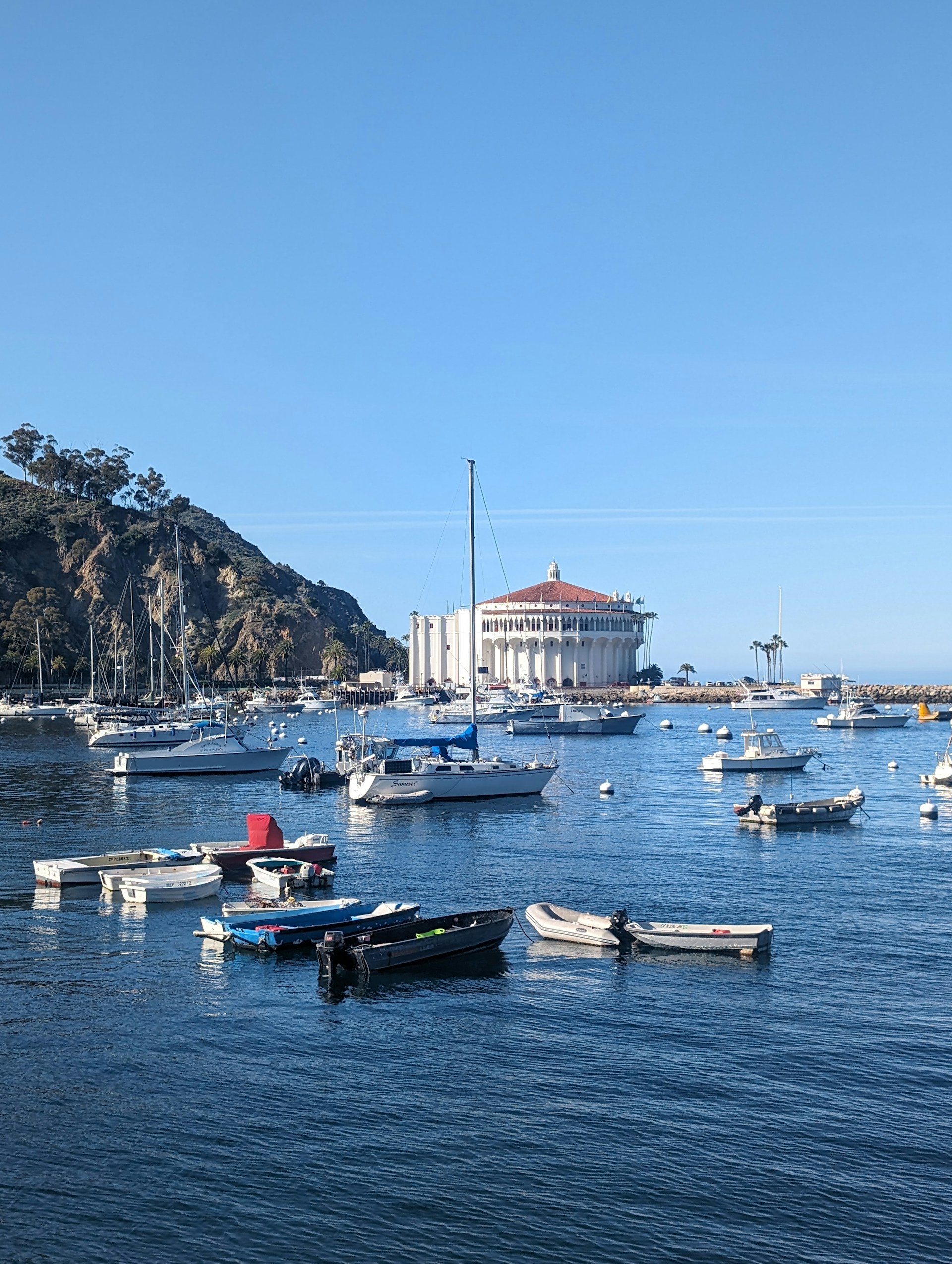 a group of boats floating on top of a body of water