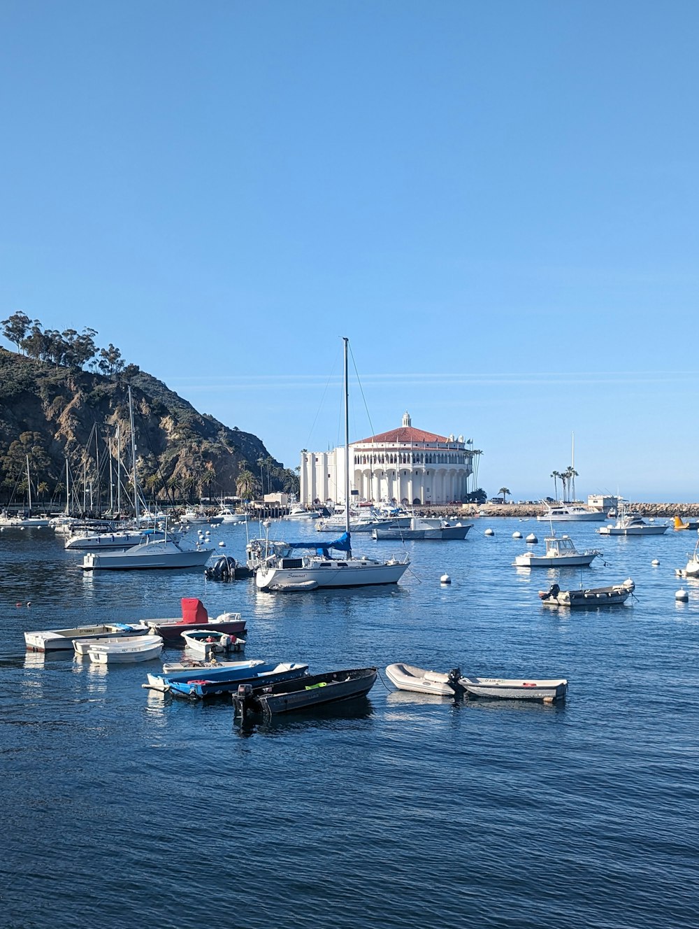 a group of boats floating on top of a body of water