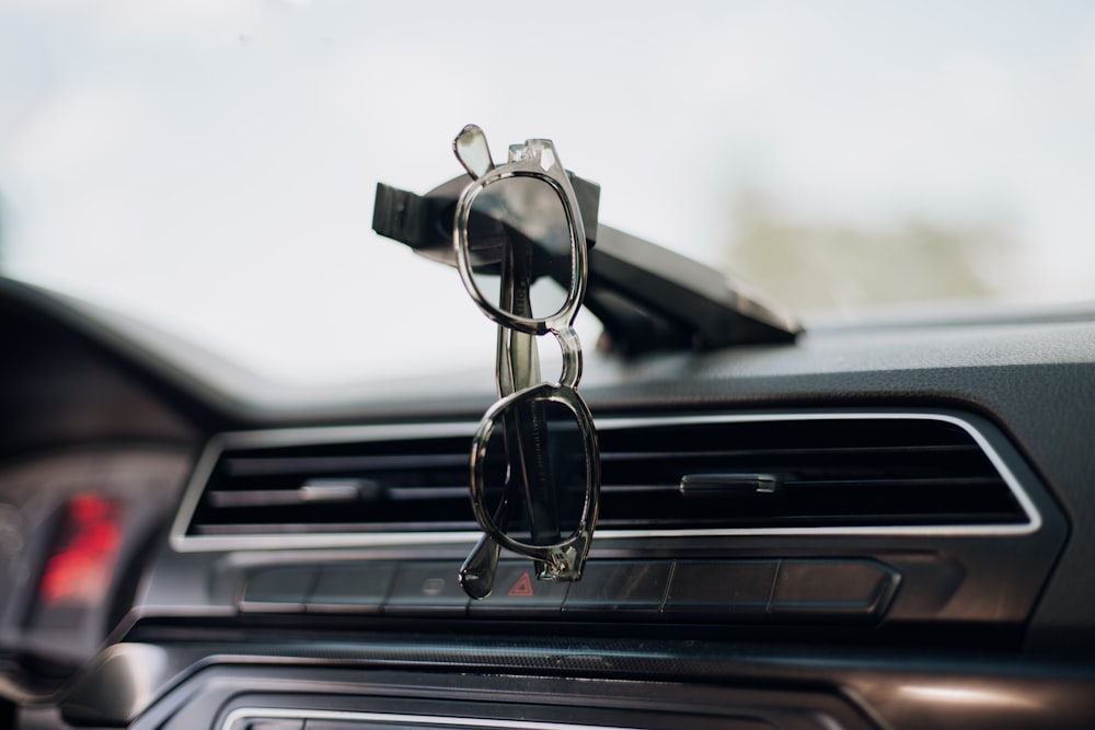 a car dashboard with a cell phone holder attached to it