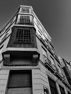 a black and white photo of a tall building