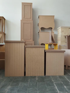a pile of cardboard boxes sitting on top of a floor