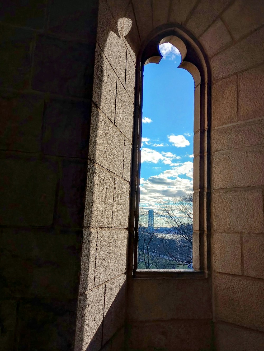 a window with a view of a city