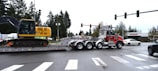 a tractor trailer being towed down a street