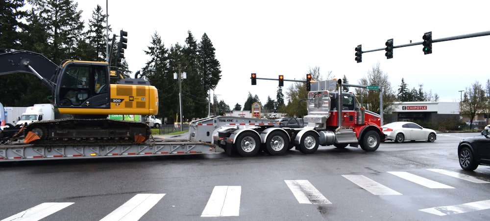 a tractor trailer being towed down a street
