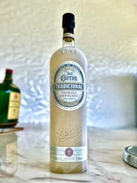 a bottle of alcohol sitting on top of a counter