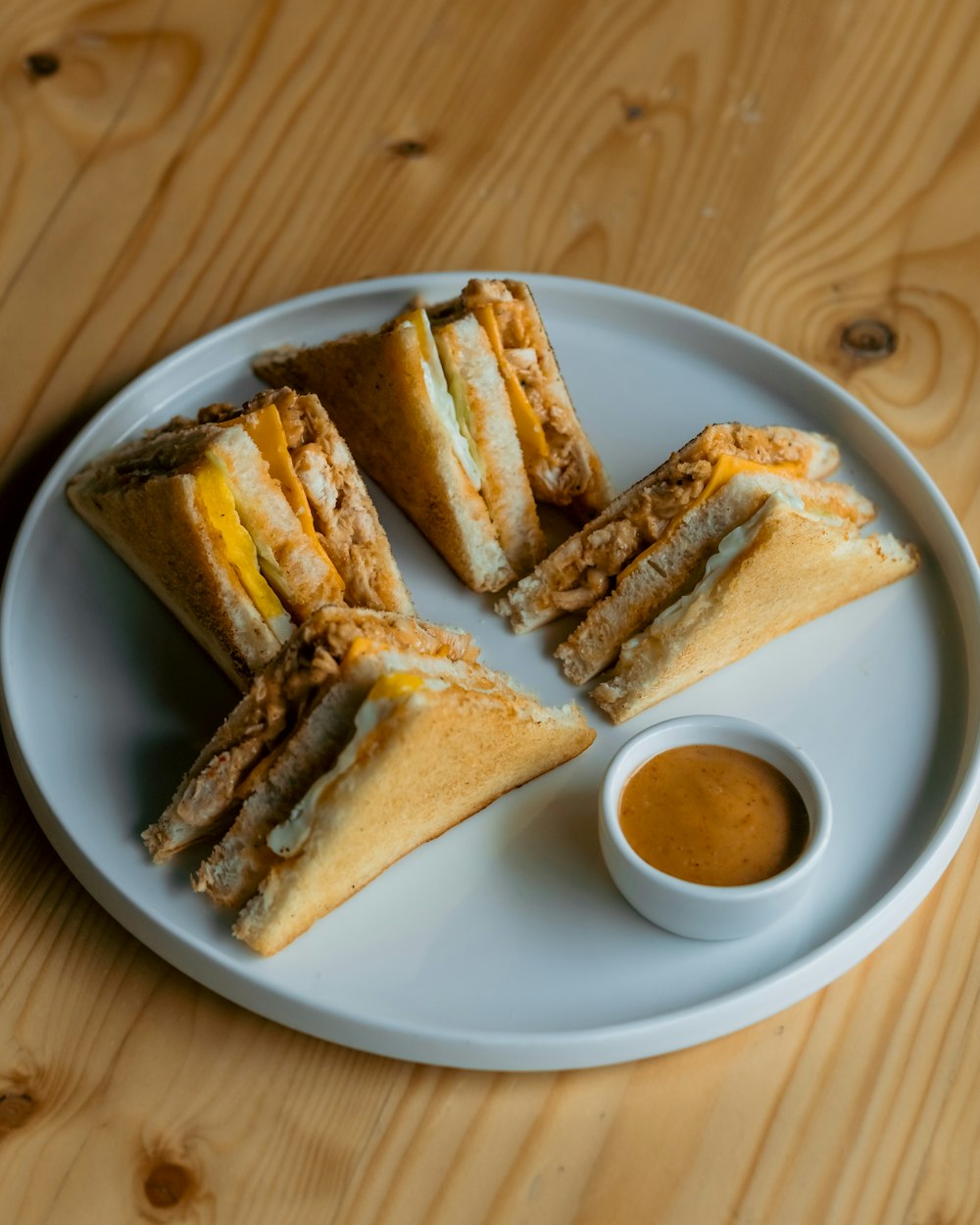 a sandwich cut in half on a white plate