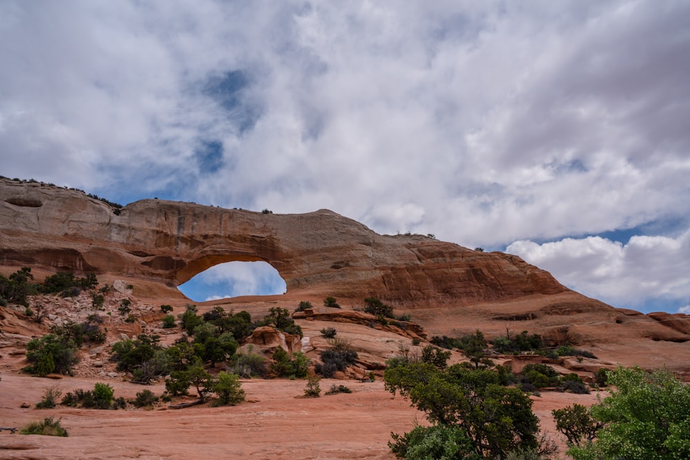 a large rock formation with a hole in the middle of it