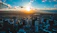 the sun is setting over a large city