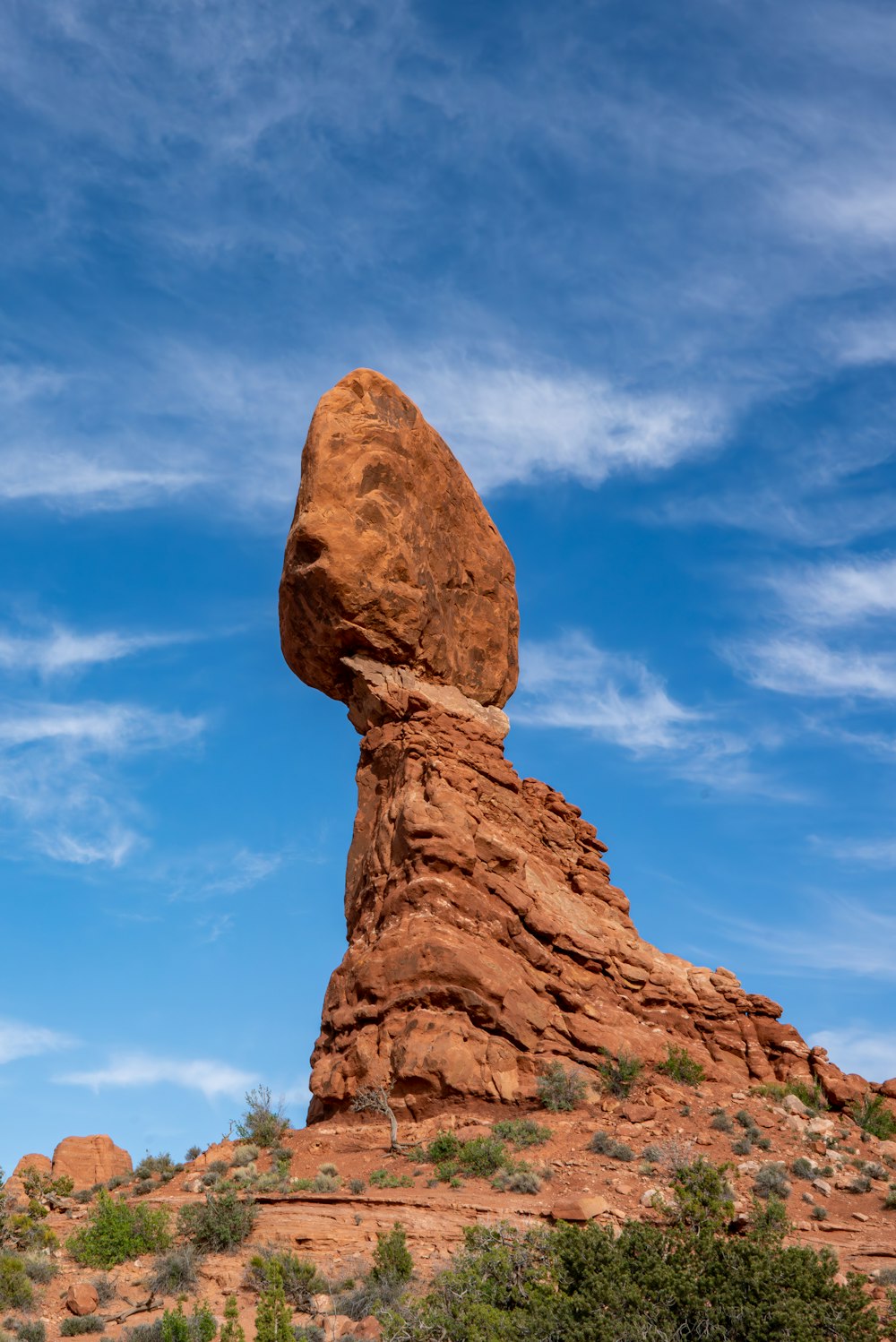 a large rock formation in the middle of a desert