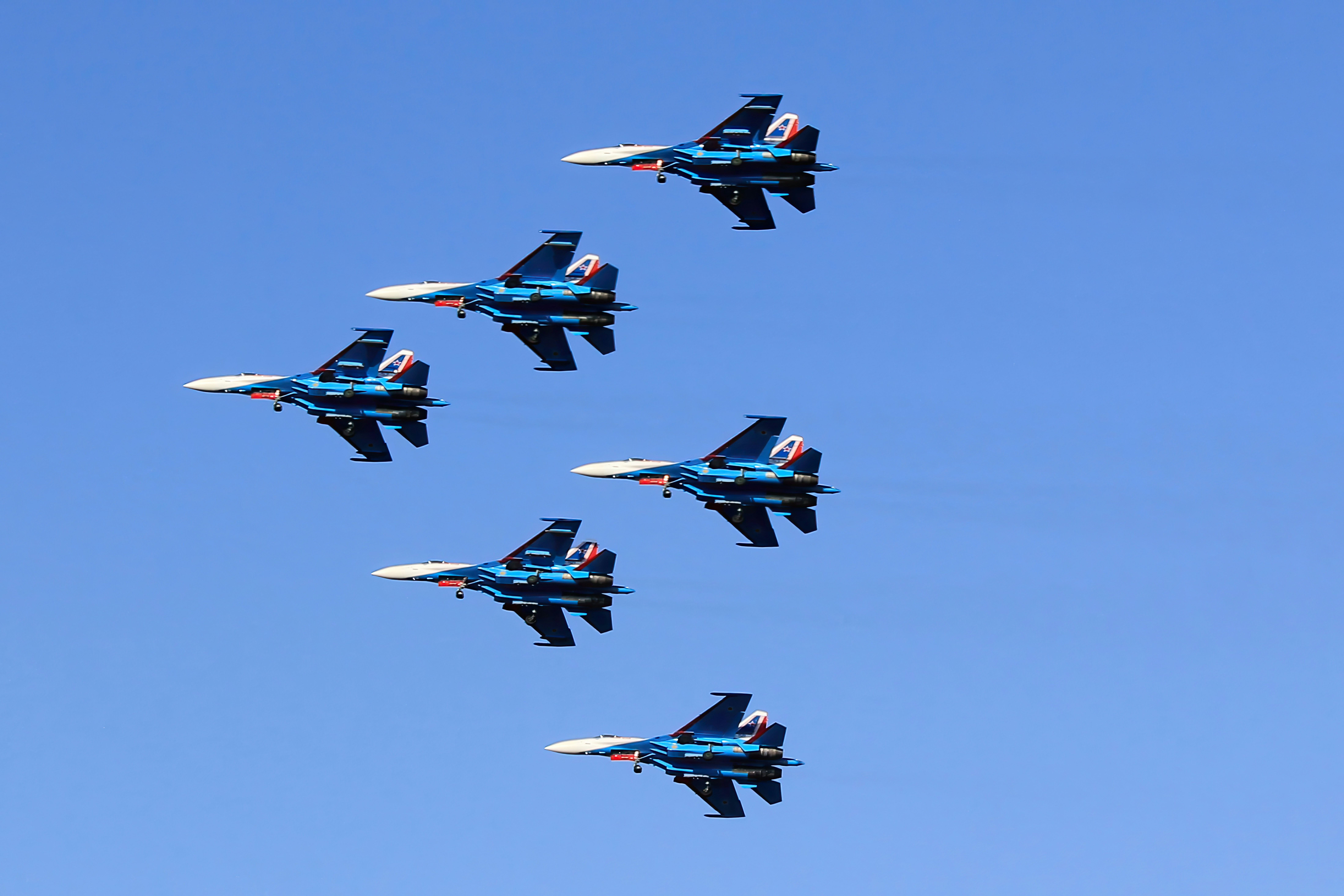 woman wearing yellow long-sleeved dress under white clouds and blue sky during daytime