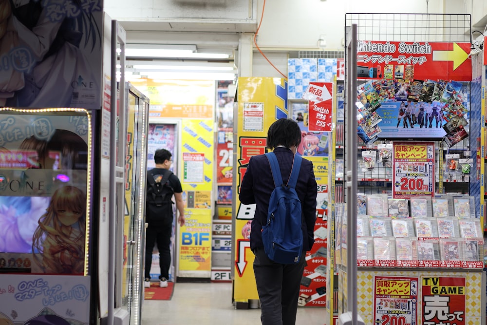 a woman walking through a store with a backpack on her back