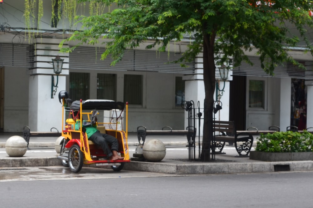 a man is riding a motorized scooter down the street