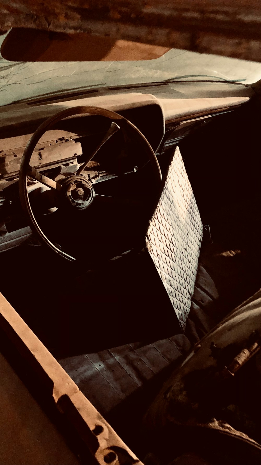 the interior of an old car with a steering wheel