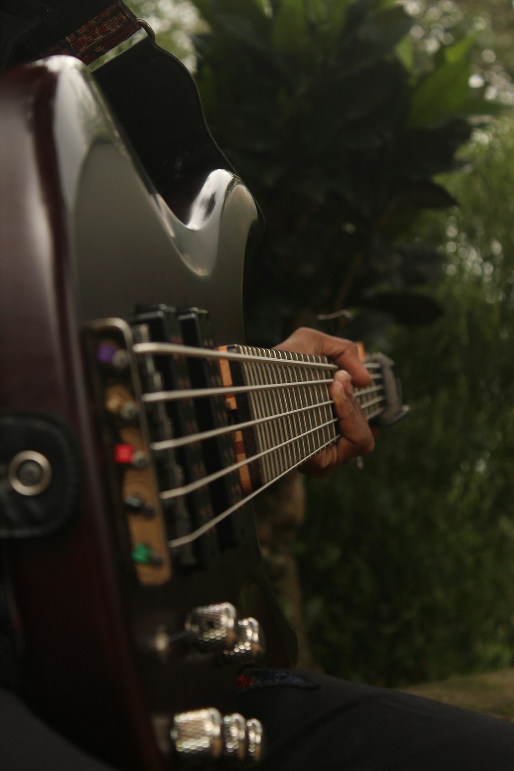 a close up of a person playing a guitar