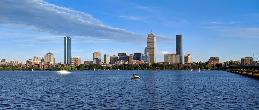 a large body of water with a city in the background