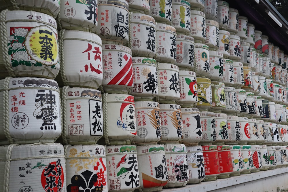 a wall full of cups with asian writing on them