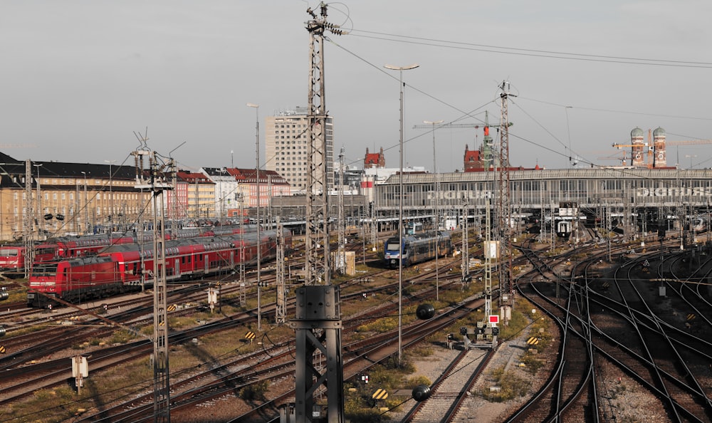 a train yard with many trains on the tracks