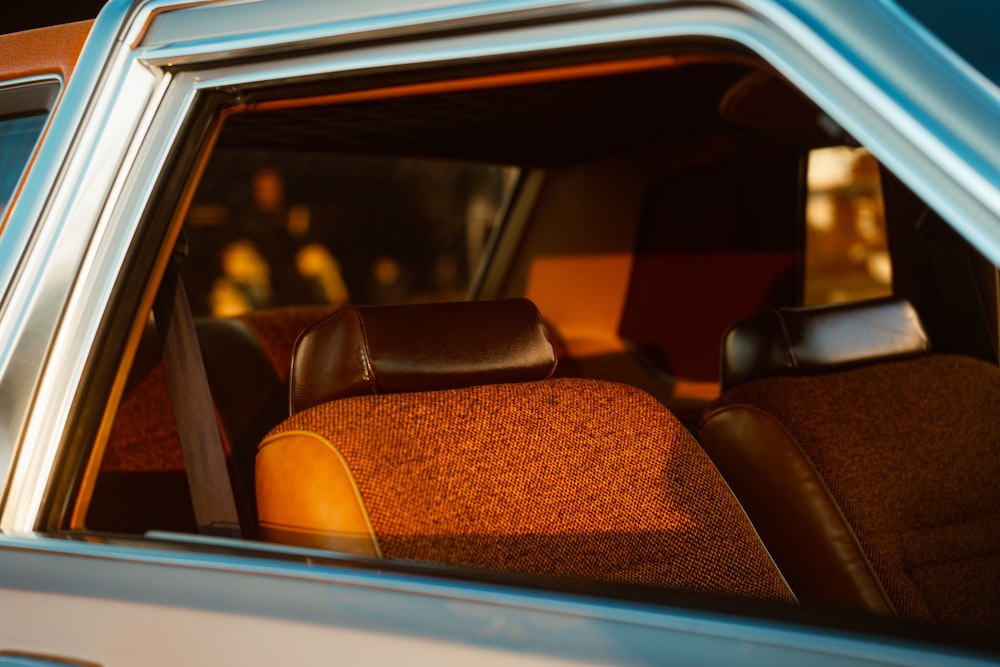 a close up of a car's interior with the door open