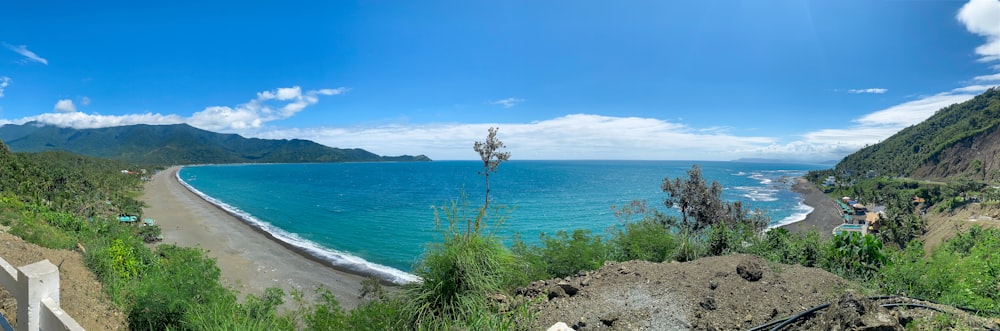 a scenic view of the ocean from a hill