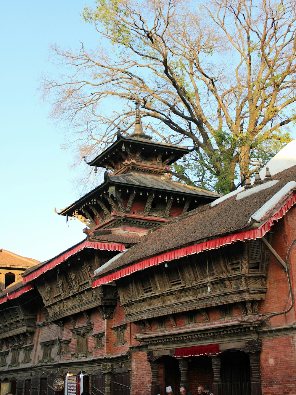 an old building with a tree in the background